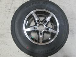 225/75R15D WESTLAKE TIRE ON A 15" 5 LUG BOBCAT WHEEL